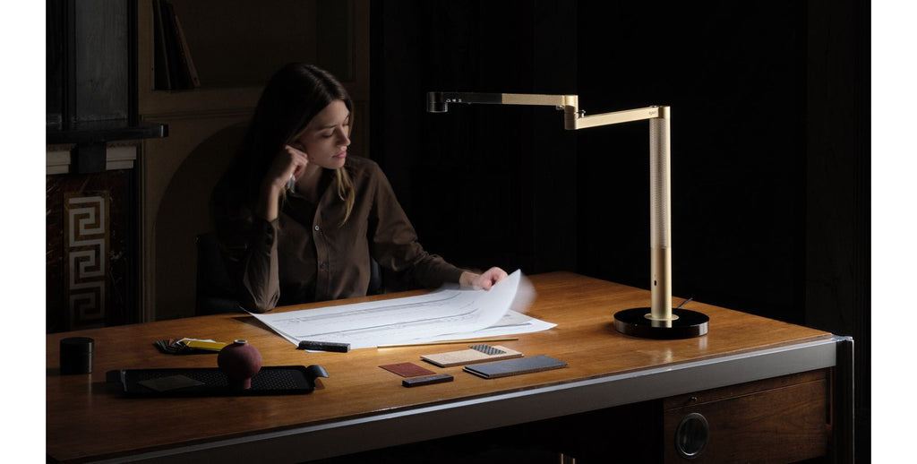 Smart LED desk lamp providing task lighting at a desk