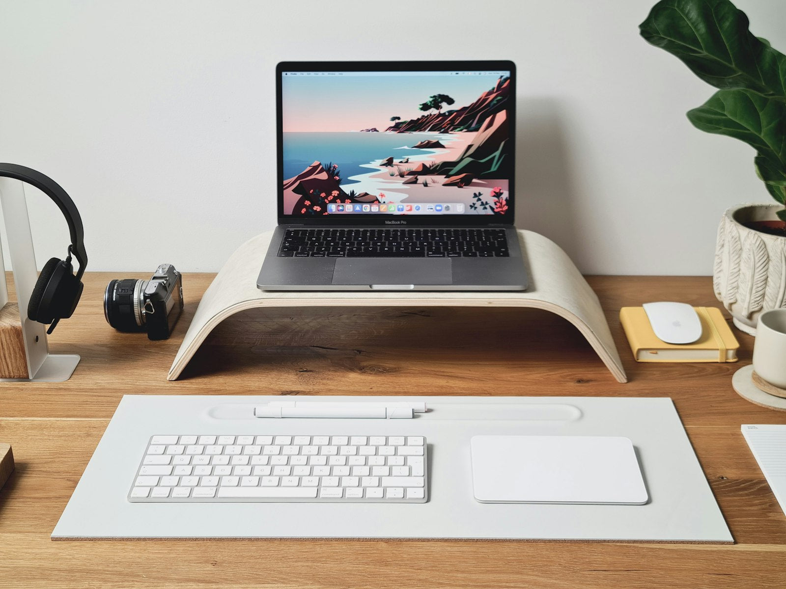 Wooden laptop stand front view on a desk